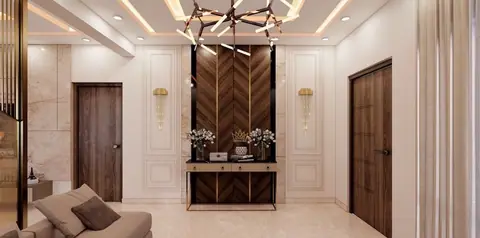 The same chevron veneer returns at the entry, framed by panelled walls and brass sconces.
