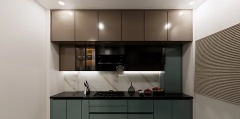 Sage cabinetry with a stone counter; the kitchen shares the living room palette exactly.
