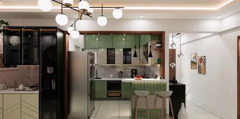 A sage kitchen with a breakfast counter, open to the dining.