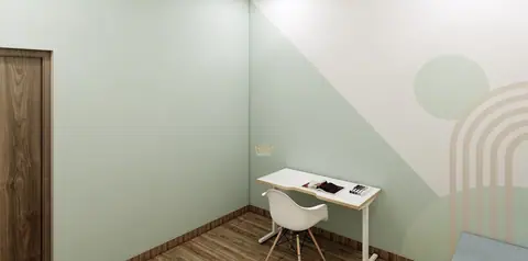 A wall-hung desk turns a corner into a study without furniture.